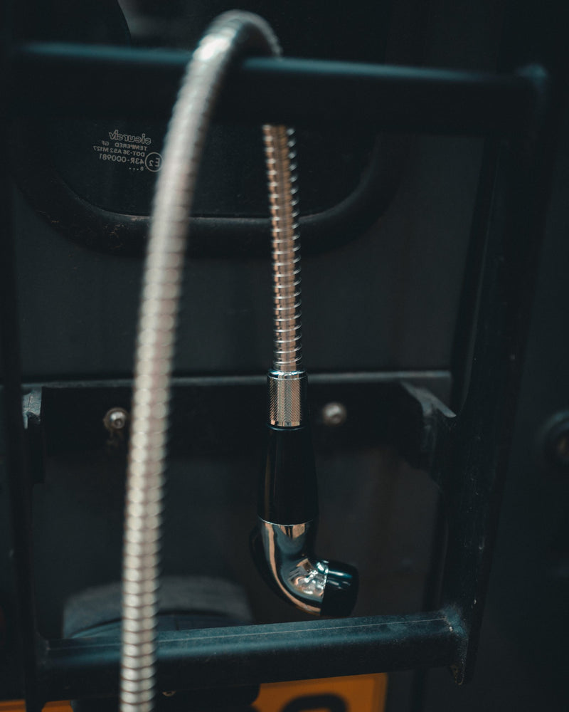 Load image into Gallery viewer, Jerrycan shower hose hanging off the back of a landrover